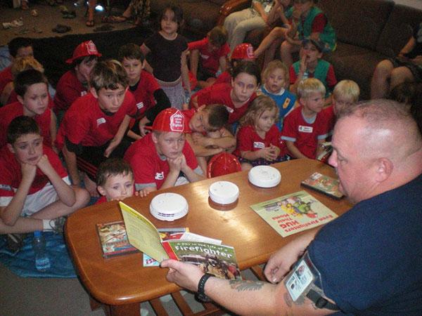 firefighter reads to kids