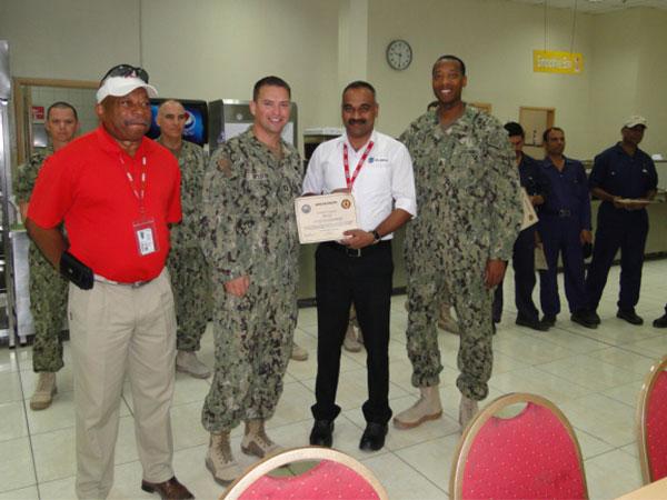 KBR Galley Managers receiving certificate of appreciation for winning the Five Star Rating from the Navy
