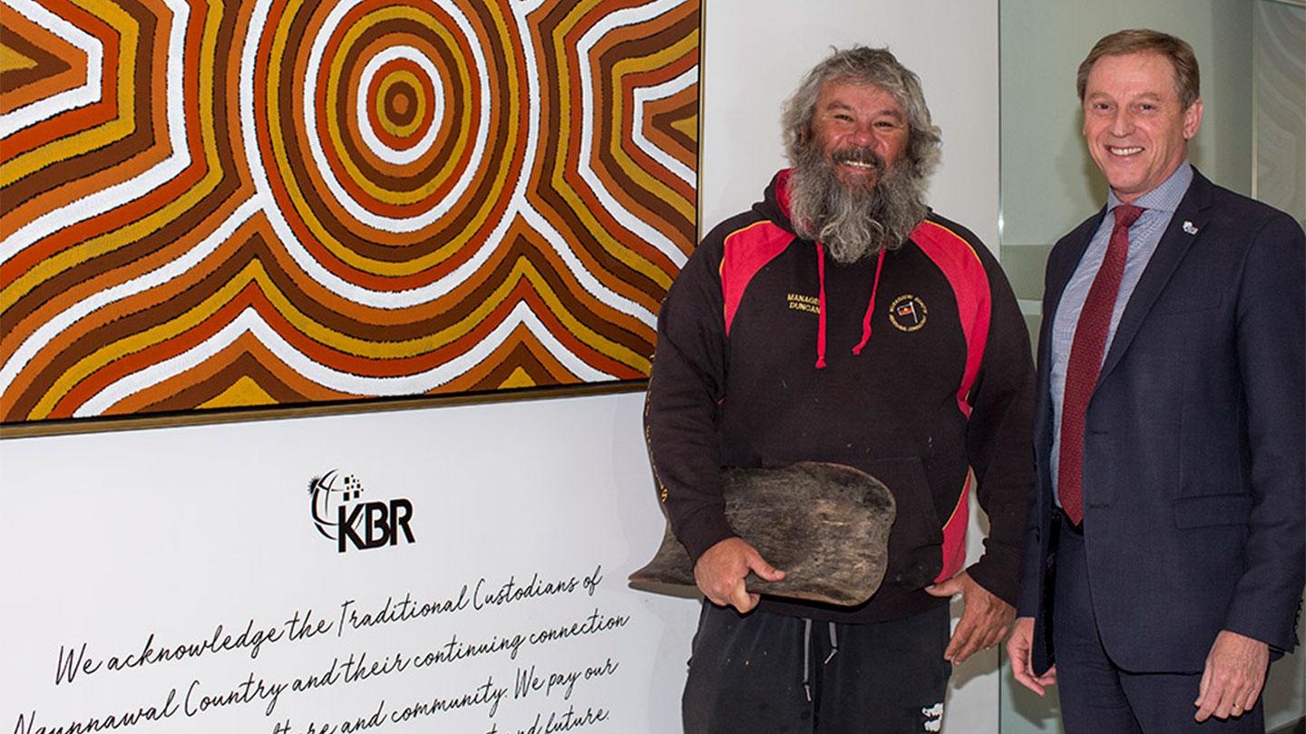 Wiradjuri artist Duncan Smith and Rob Hawketts Vice President of KBR Government Solutions APAC